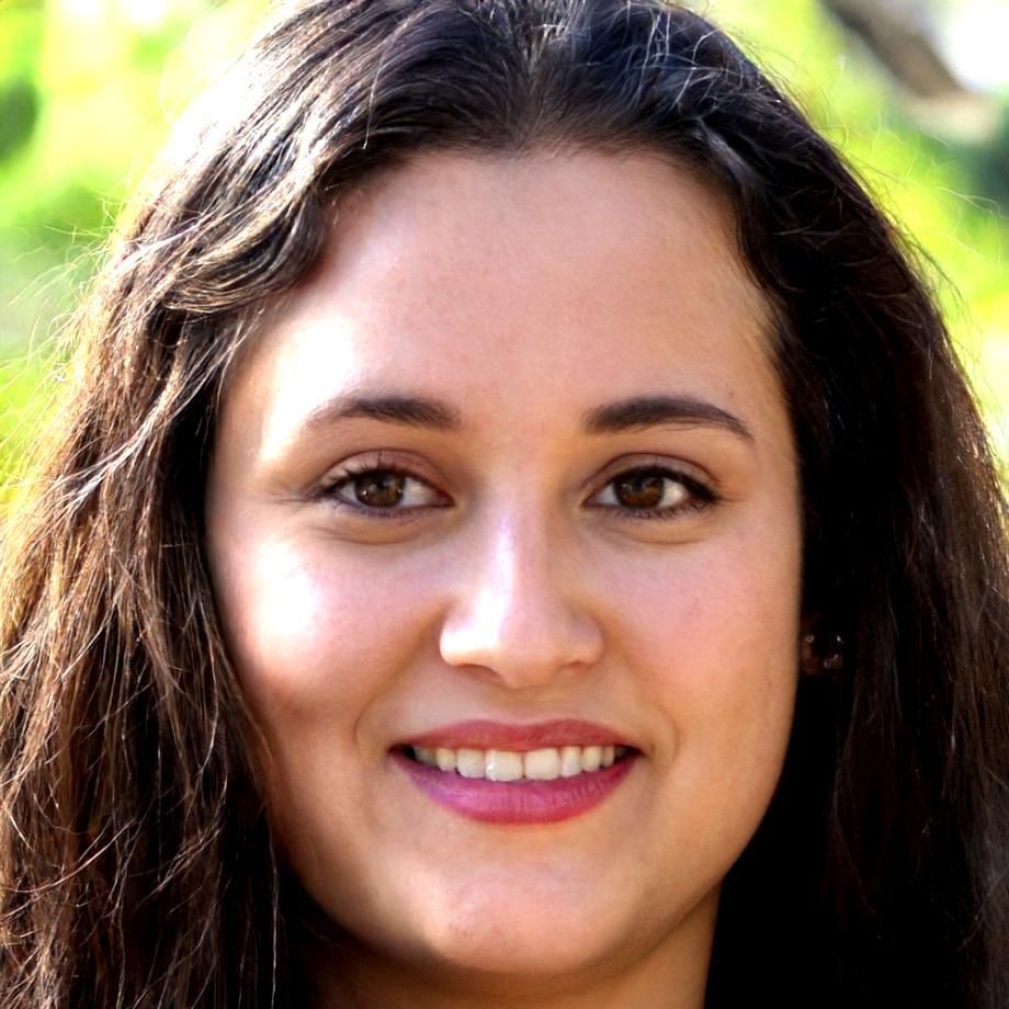 Professional woman in business attire smiling confidently