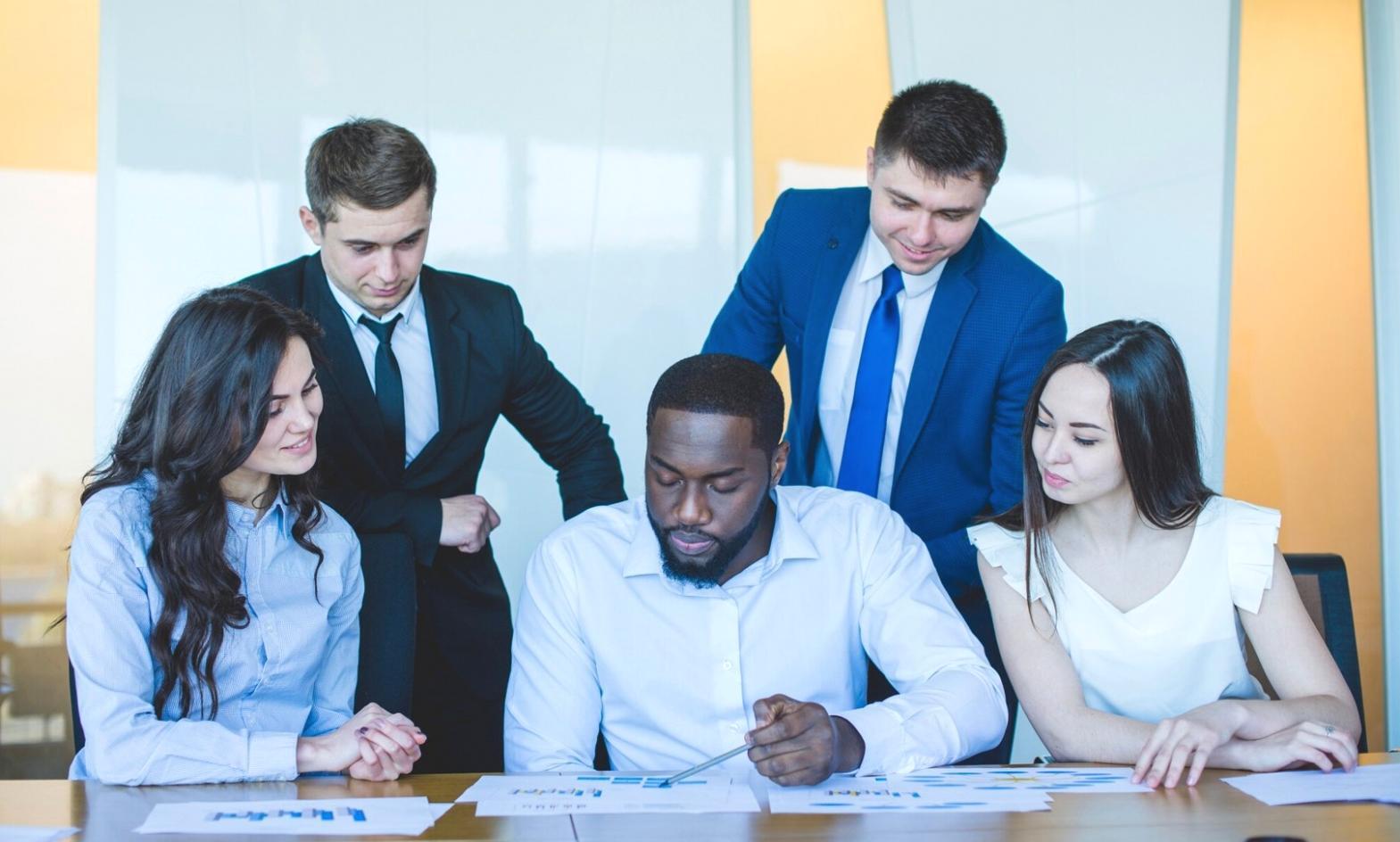 Financial planning session with Australian professionals reviewing investment portfolios and budgeting strategies