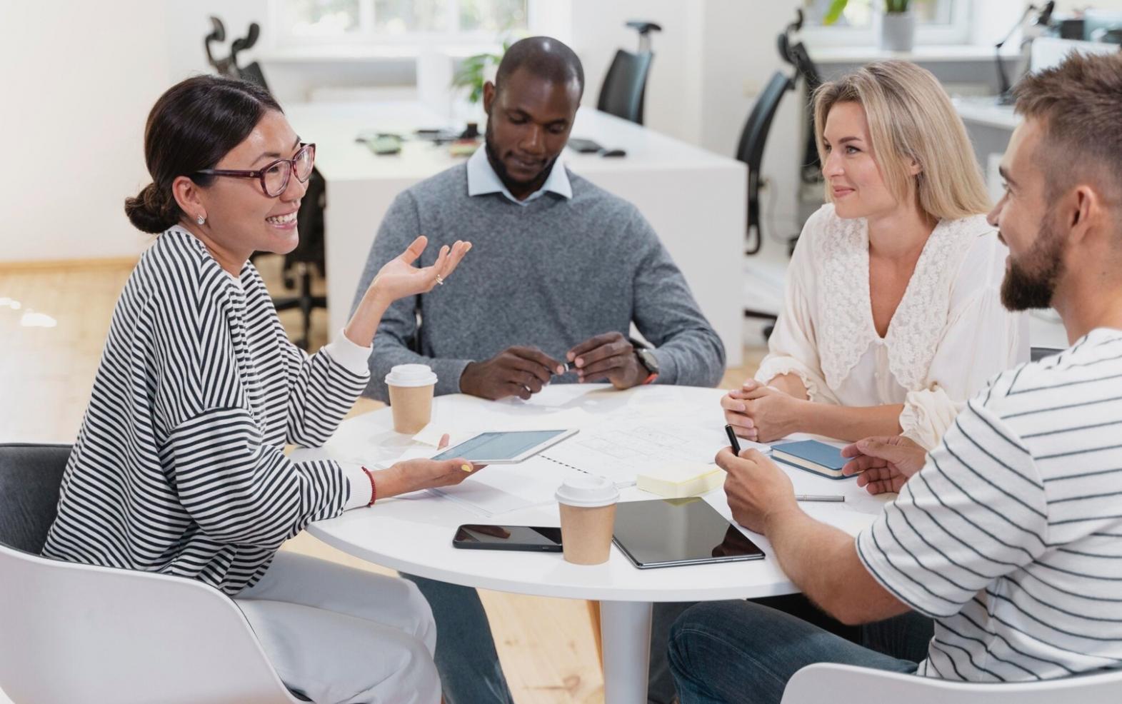 Diverse group of Australian adults participating in an engaging financial literacy workshop with practical exercises